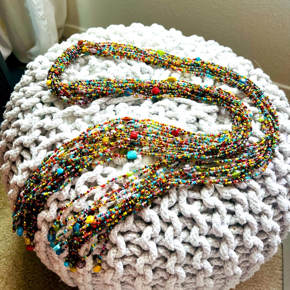 Beaded multi-color wrap necklace by Anthropologie. Total length is 54”.